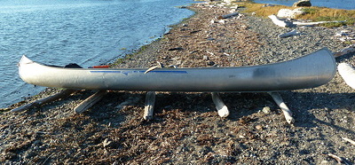 Canoe ready to launch off driftwood. Photo by Alex Shapiro.